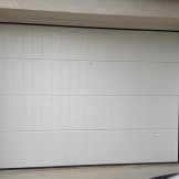 Réalisation d'une porte de garage manuelle PVC BPSC Océane